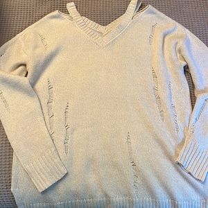 Distressed white sweater